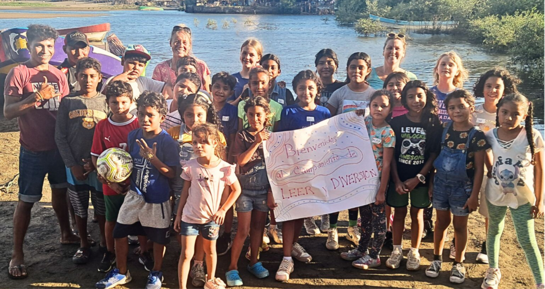 Our Camp group happy with our handmade sign