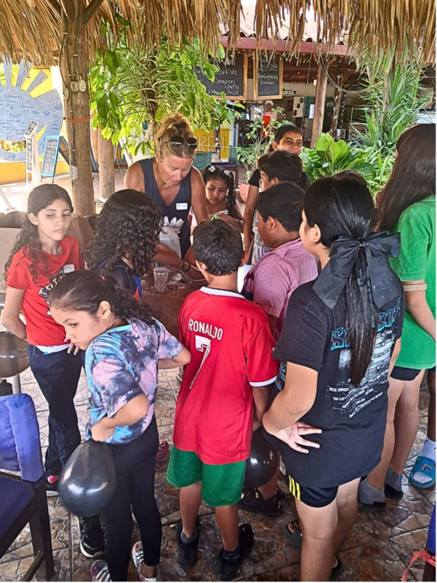 Ms. Mitzi talking with local children in Las Peñitas.